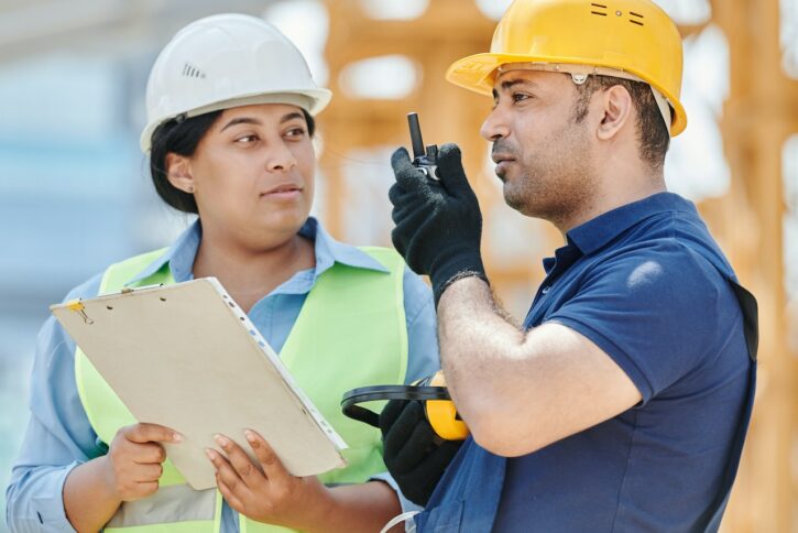 Construction employee and foreman preparing site for OSHA visit