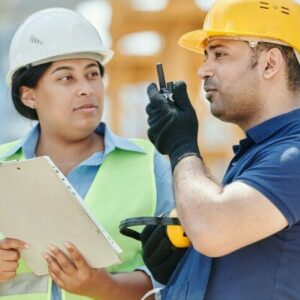 Construction employee and foreman preparing site for OSHA visit